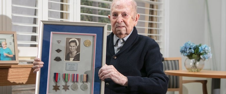An elderly gentleman with his War medals