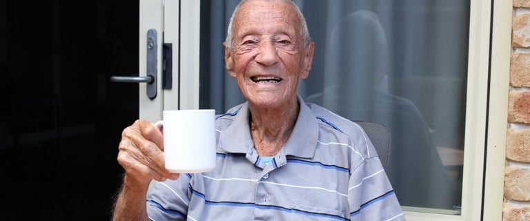 Centenarian George enjoying a cup of tea