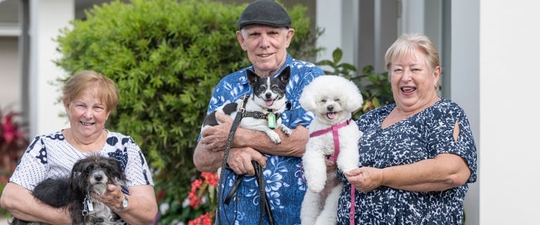 Breezes residents enjoy a stroll with their pups