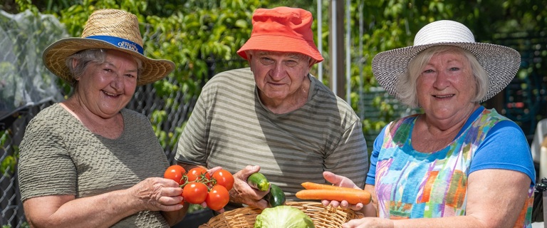 Rowes Bay residents in the community garden