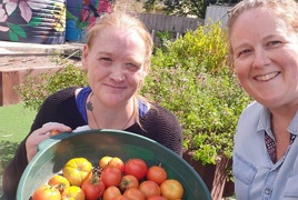 Carol (HPP Client) and Julie (CHRN HPP) with harvested tomatoes