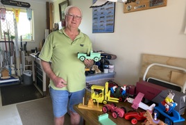 Dennis with toys in his workshop.JPEG