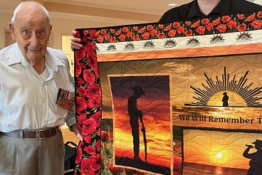 Herbert receiving Quilt of Valour