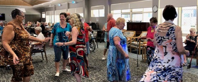 A group of retirement village residents dancing