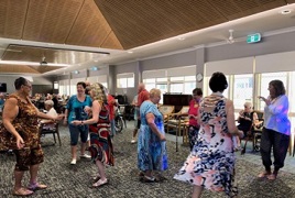 A group of retirement village residents dancing