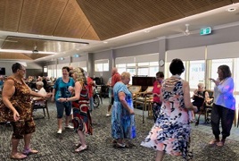A group of retirement village residents dancing A group of retirement village residents dancing