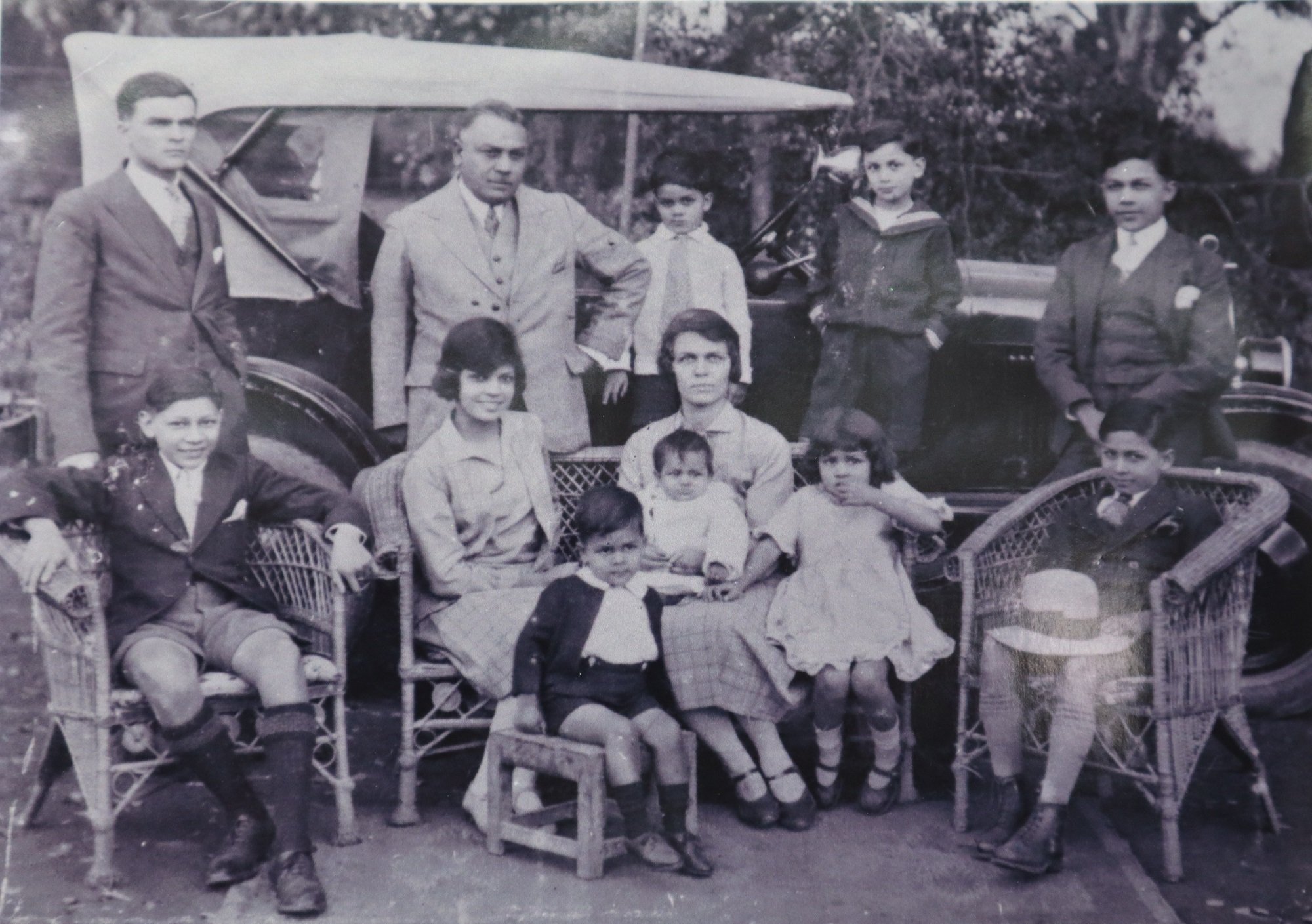 Young Michael (on chair, right) with his family