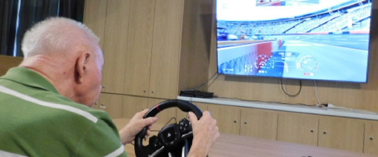 Allan driving with the PS4 simulator.jpg Allan driving with the PS4 simulator.jpg