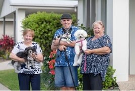 Breezes residents enjoy a stroll with their pups