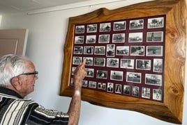 Frank looking through his photos from the early days of Caboolture_.jpg Frank looking through his photos from the early days of Caboolture_.jpg