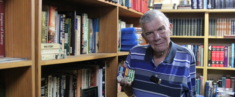 Gus in his home library.jpg Gus in his home library.jpg