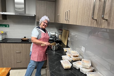 Margaret cooking up meals during the Townsville floods_.jpg