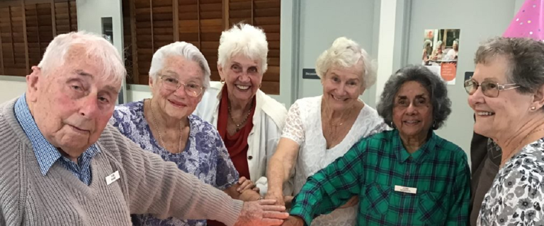 The original residents cutting the cake for the Birthday Bash 