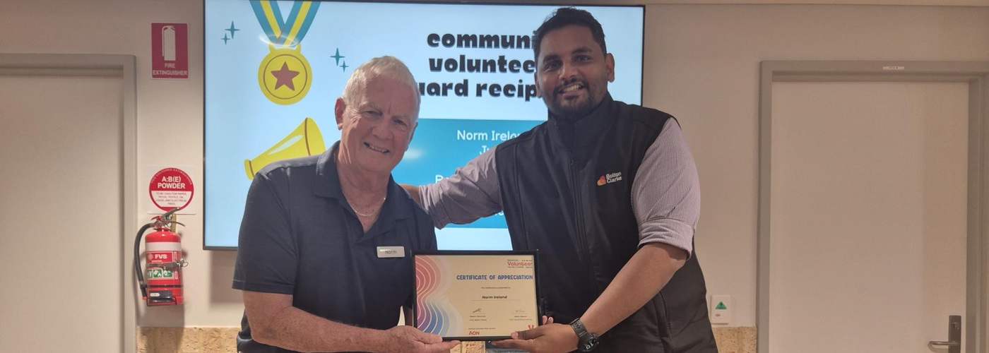 Norm accepting his volunteers certificate.jpg