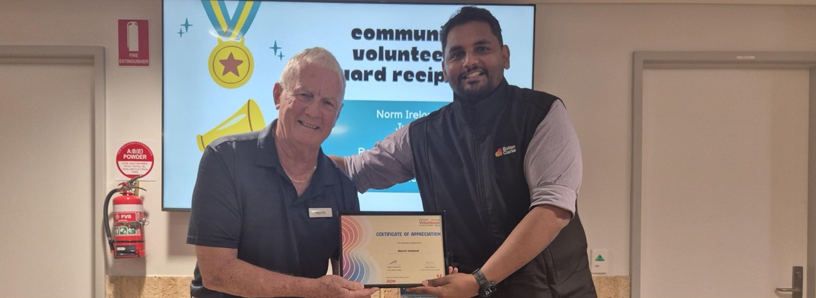Norm accepting his volunteers certificate.jpg Norm accepting his volunteers certificate.jpg