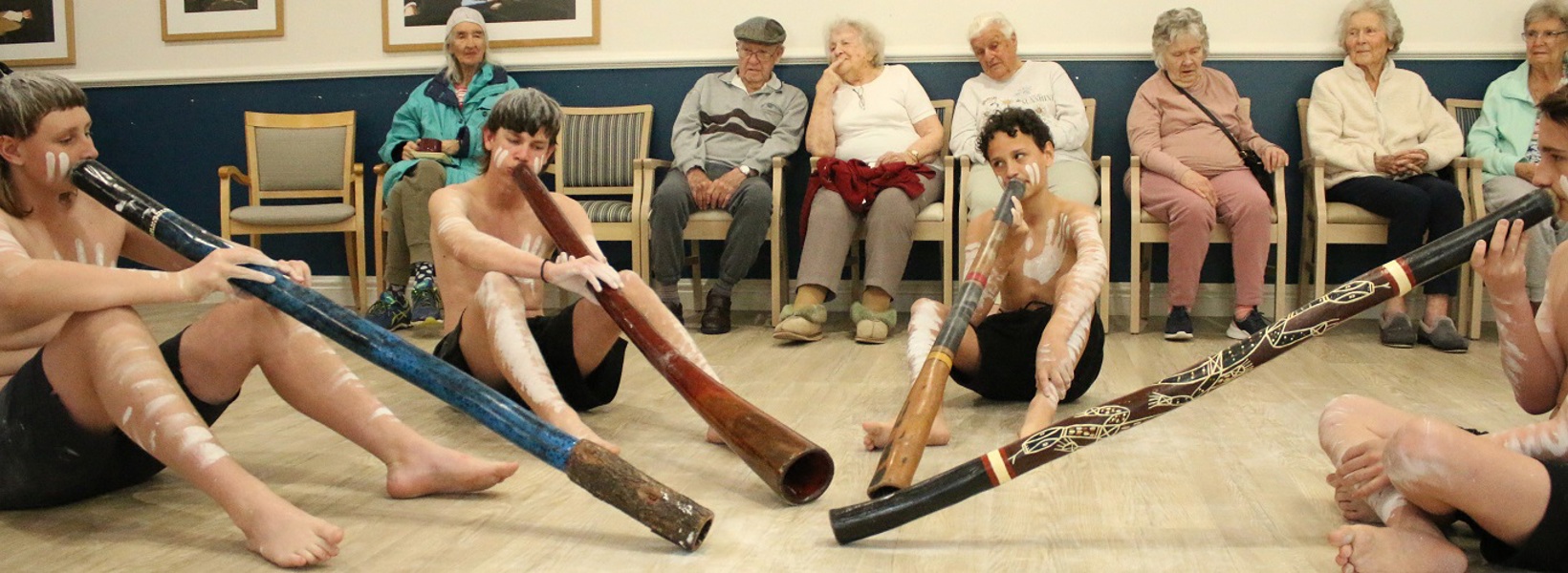 Students playing didgeridoo for residents.jpg Students playing didgeridoo for residents.jpg