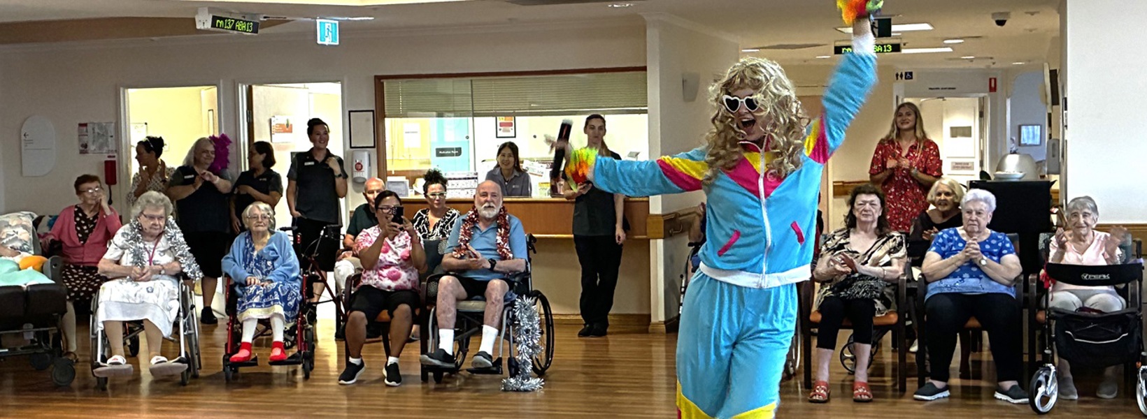 Team members performing for residents.jpg Team members performing for residents.jpg
