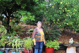 Wendy in her garden at Bongaree