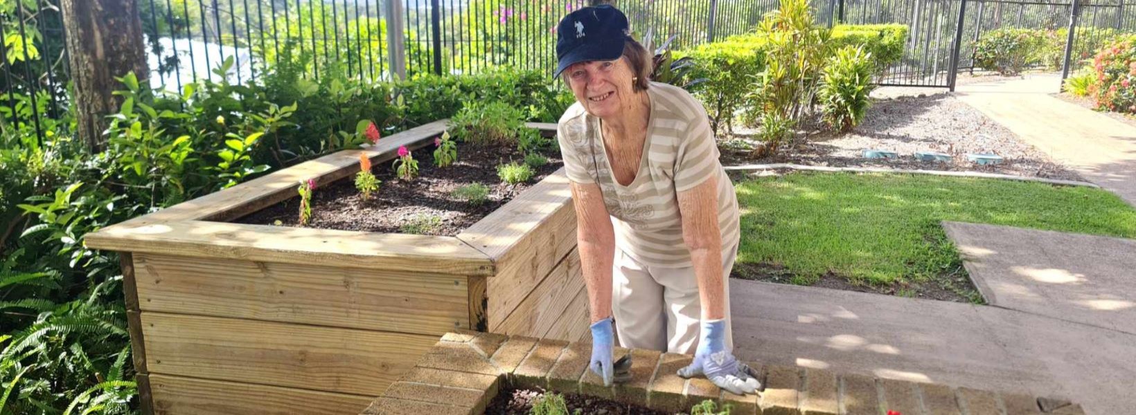 Resident Dianna tending to plants in the Buderim Views Goodness Garden. Resident Dianna tending to plants in the Buderim Views Goodness Garden.