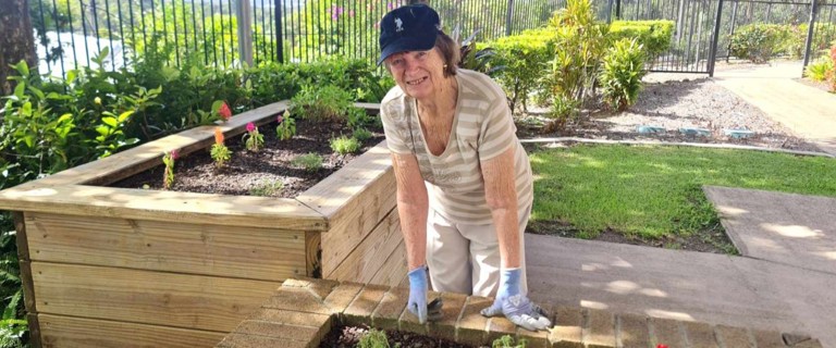 Resident Dianna tending to plants in the Buderim Views Goodness Garden. Resident Dianna tending to plants in the Buderim Views Goodness Garden.